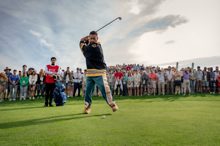 Happy Gilmore 2. (L to R) Benito Antonio Martínez Ocasio as Busboy and Adam Sandler as Happy Gilmore in Happy Gilmore 2. Cr. Scott Yamano/Netflix © 2024.