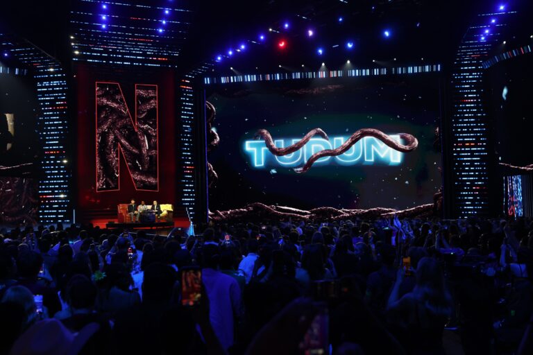 INGLEWOOD, CALIFORNIA - MAY 31: (L-R) Noah Schnapp, Caleb McLaughlin, and Finn Wolfhard speak onstage during NETFLIX TUDUM 2025: THE LIVE EVENT at The Kia Forum on May 31, 2025 in Inglewood, California. (Photo by Kevin Mazur/Getty Images for Netflix)